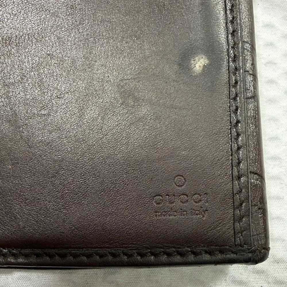 Gucci Dark Brown Embossed Clutch wallet inside is clean. GUC much life left!